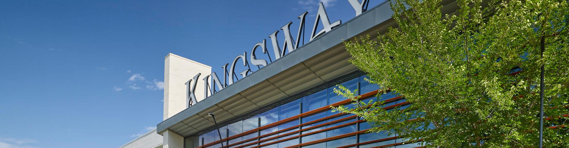Kingsway mall exterior sign on a glass facade against a clear blue sky