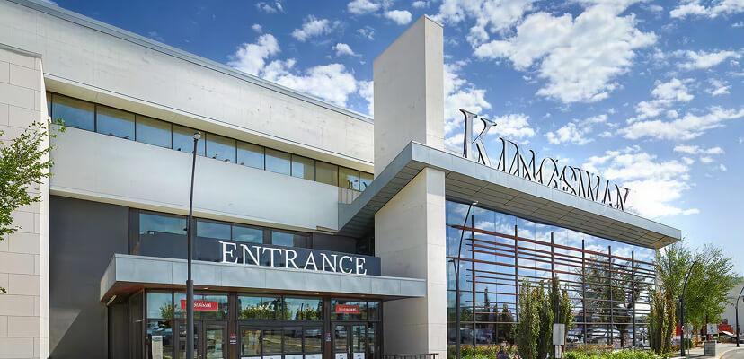 Kingsway mall entrance with a canopy and signage under a blue cloudy sky