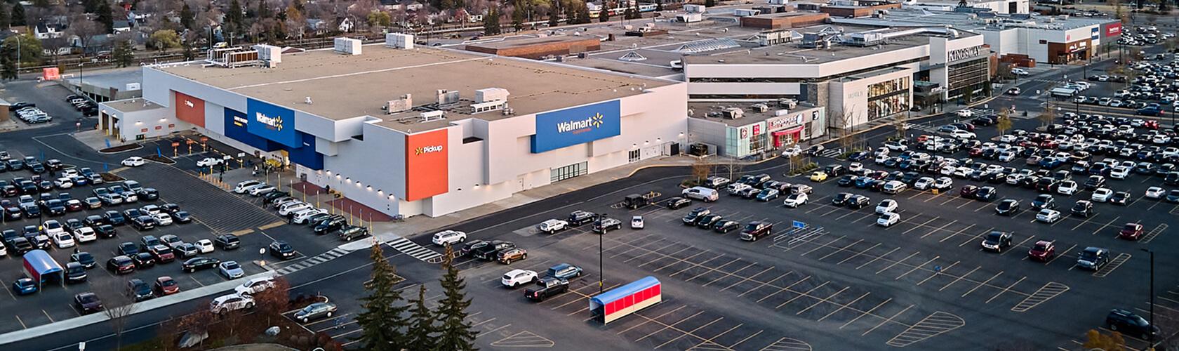 Aerial view of a Walmart store and busy parking lot at a shopping centre