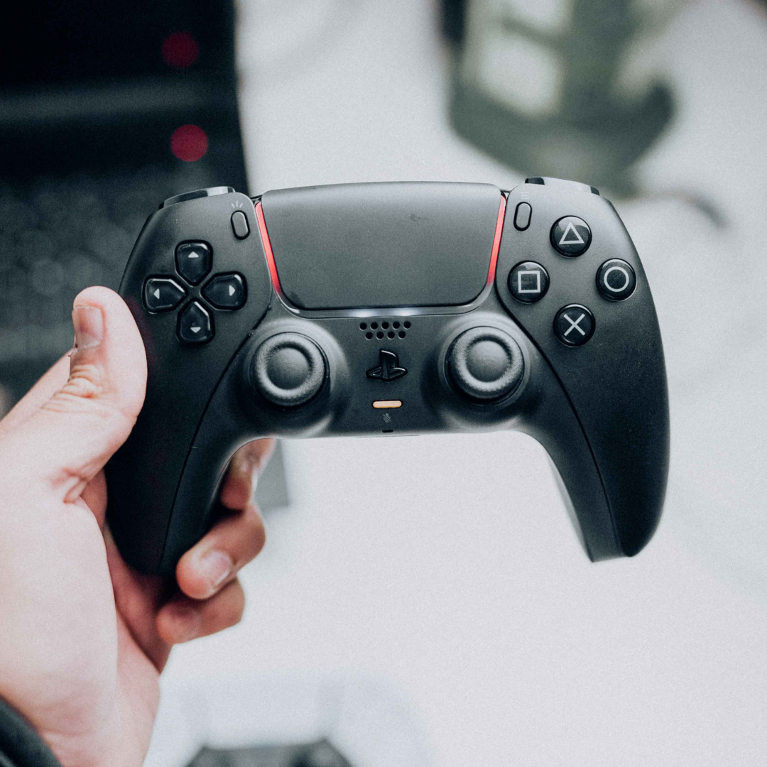 Image of a person holding up a game controller