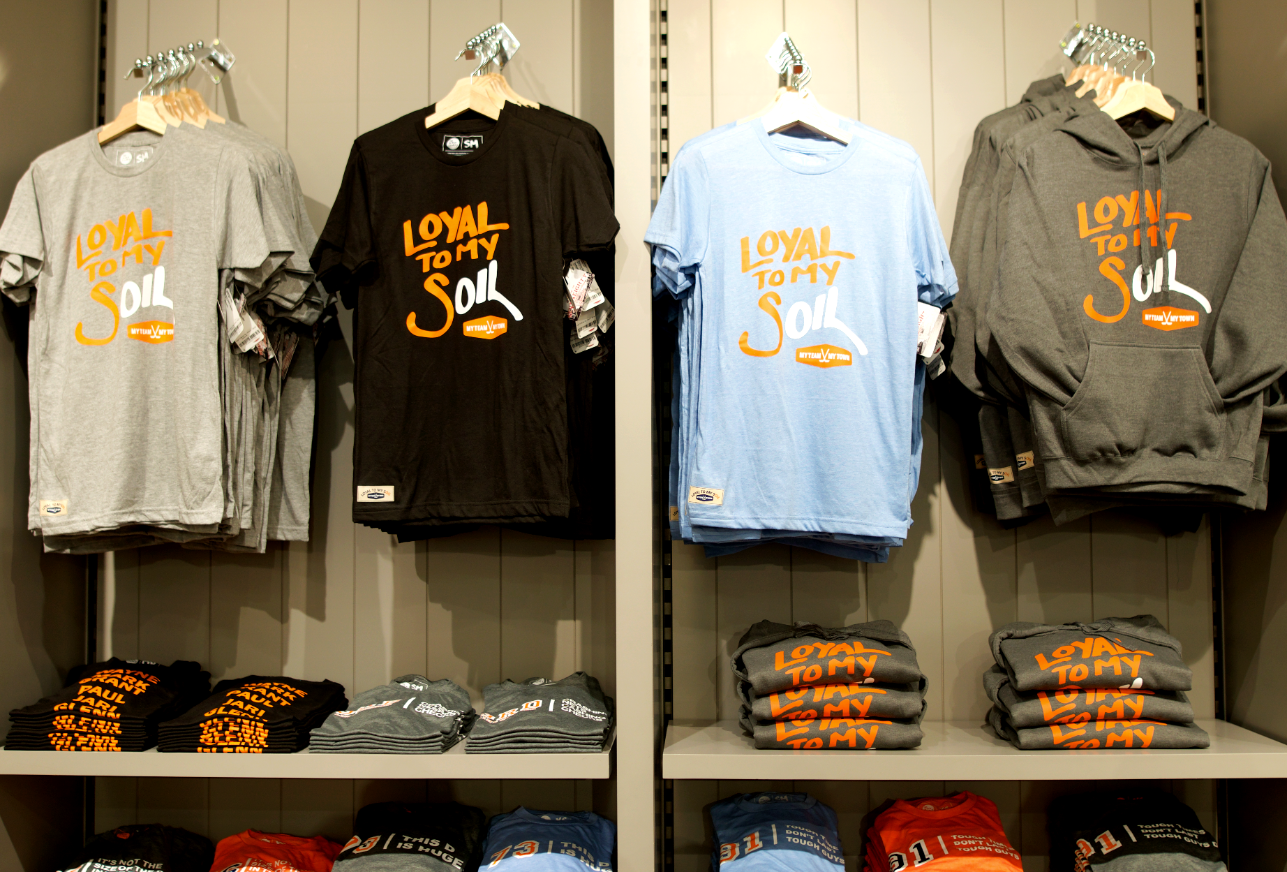 store display of t-shirts with "Loyal to my soil" graphic