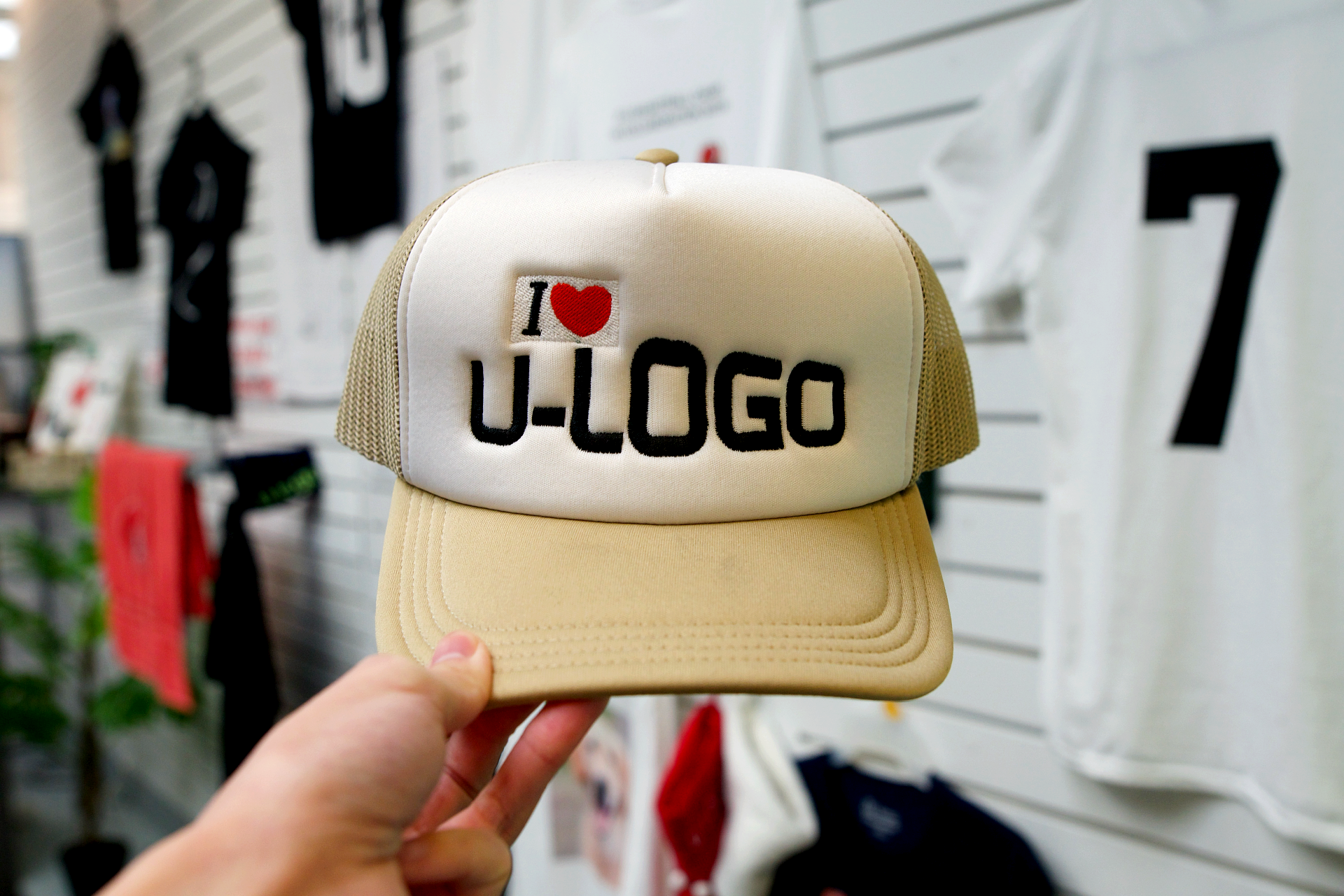 beige trucker hat with "I love U-Logo" embroidery