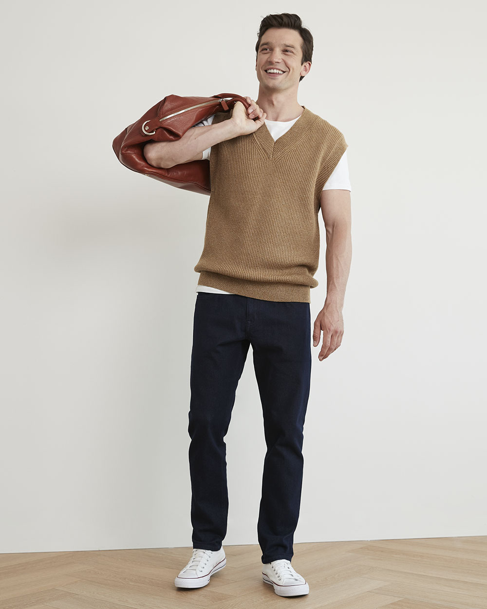 model wearing sweater vest and pants