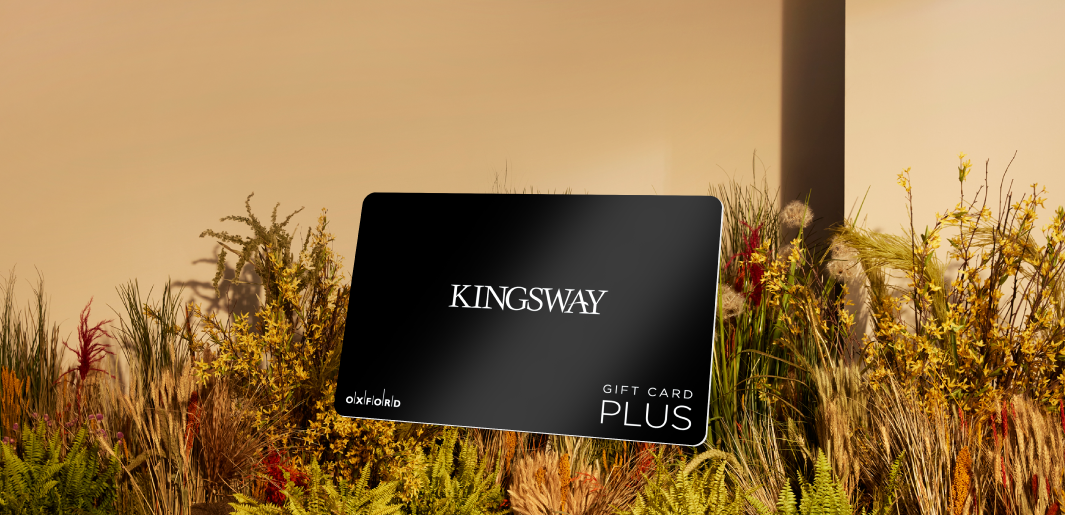 promotional image of a black kingsway gift card atop fall foliage