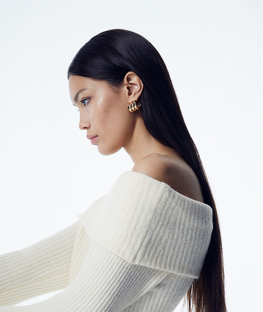 model wearing statement earrings