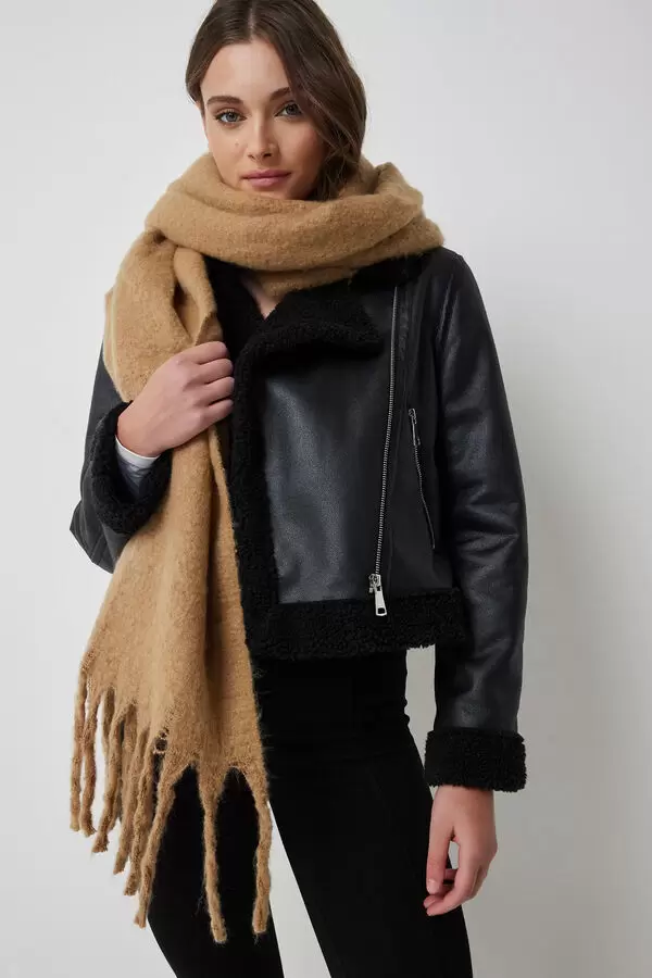 girl wearing leather jacket and brown blanket scarf