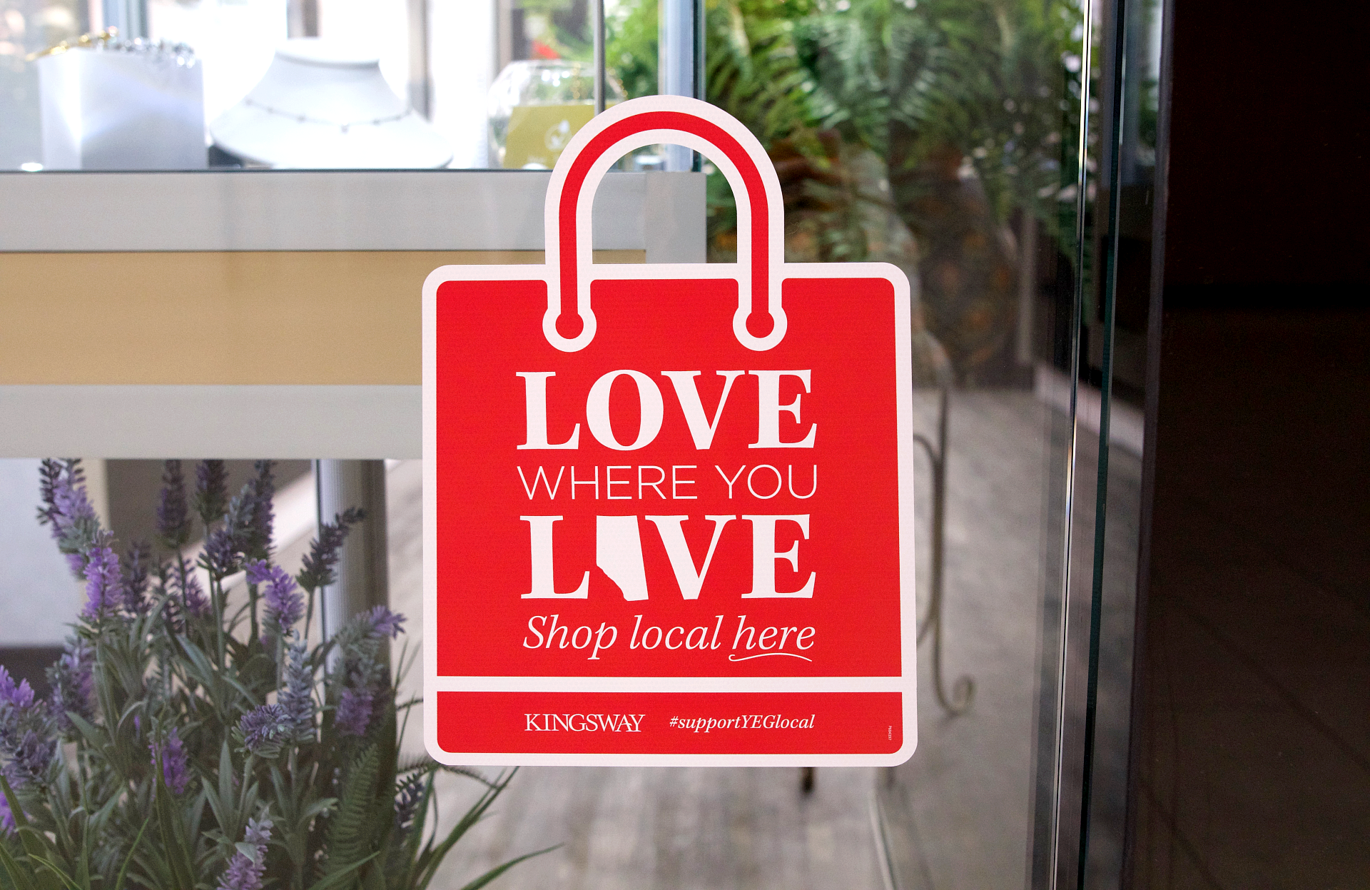 Window decal of red shopping bag with 