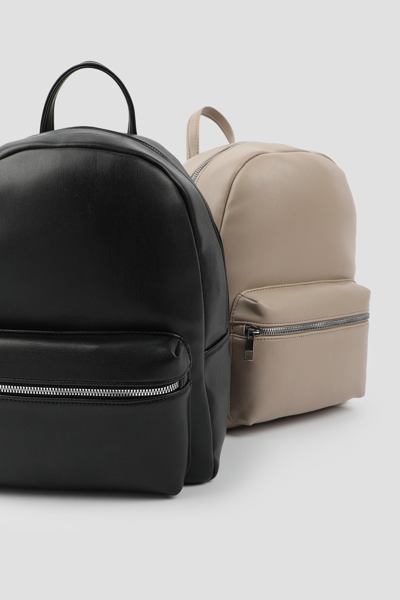 black and tan zippered backpacks