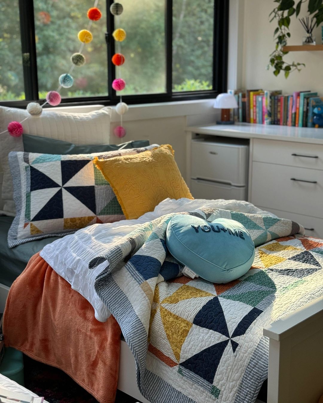 patterned and colored duvet set with heart shaped decor pillow in girl's bedroom