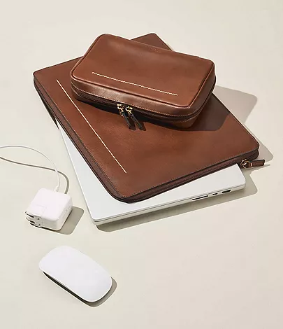 brown leather wallet and laptop case set