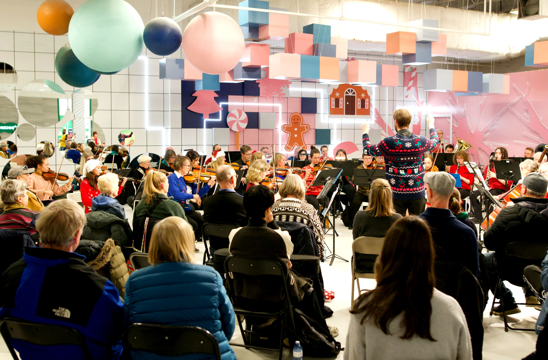 Edmonton Philharmonic Orchestra performing in HyperPOP at Kingsway Mall with large audience