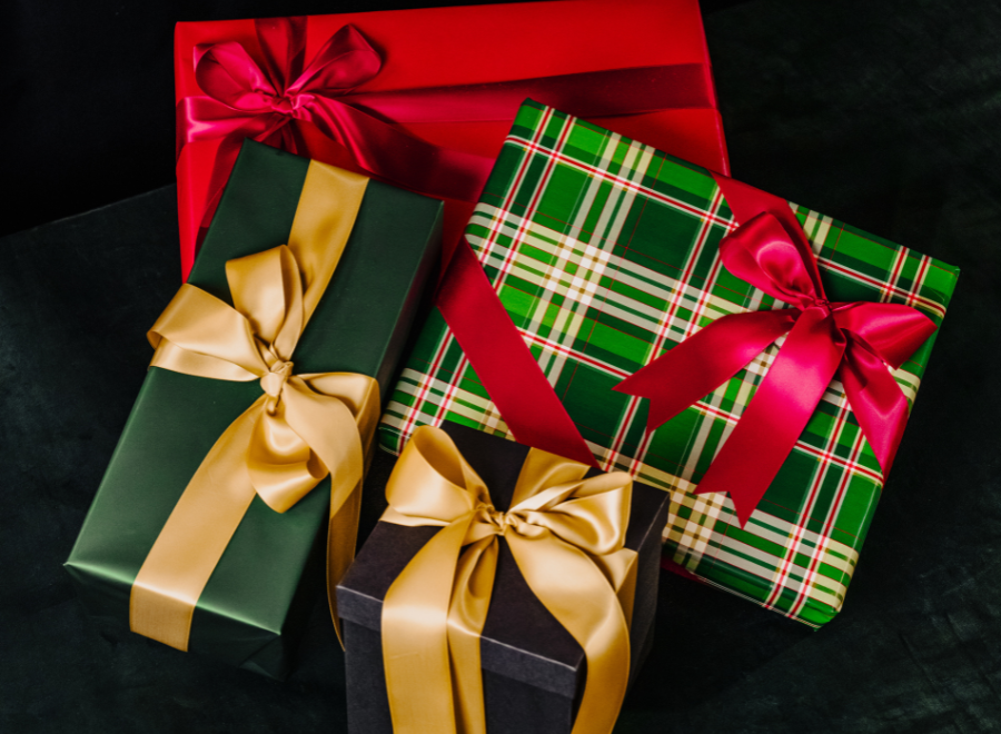 Wrapped gifts in Green, red and gold with Bows