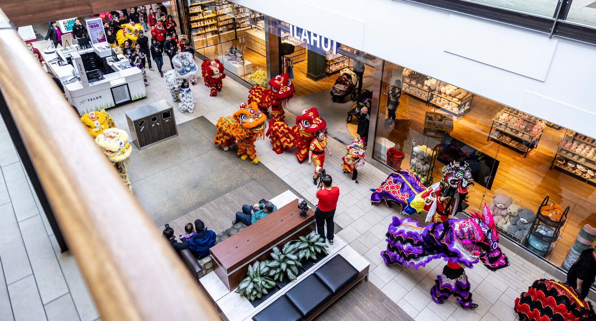 lion dance parade within hallways of Kingsway Mall