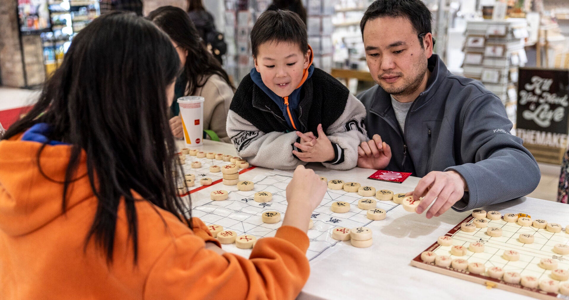 father and son playing a Chinese game