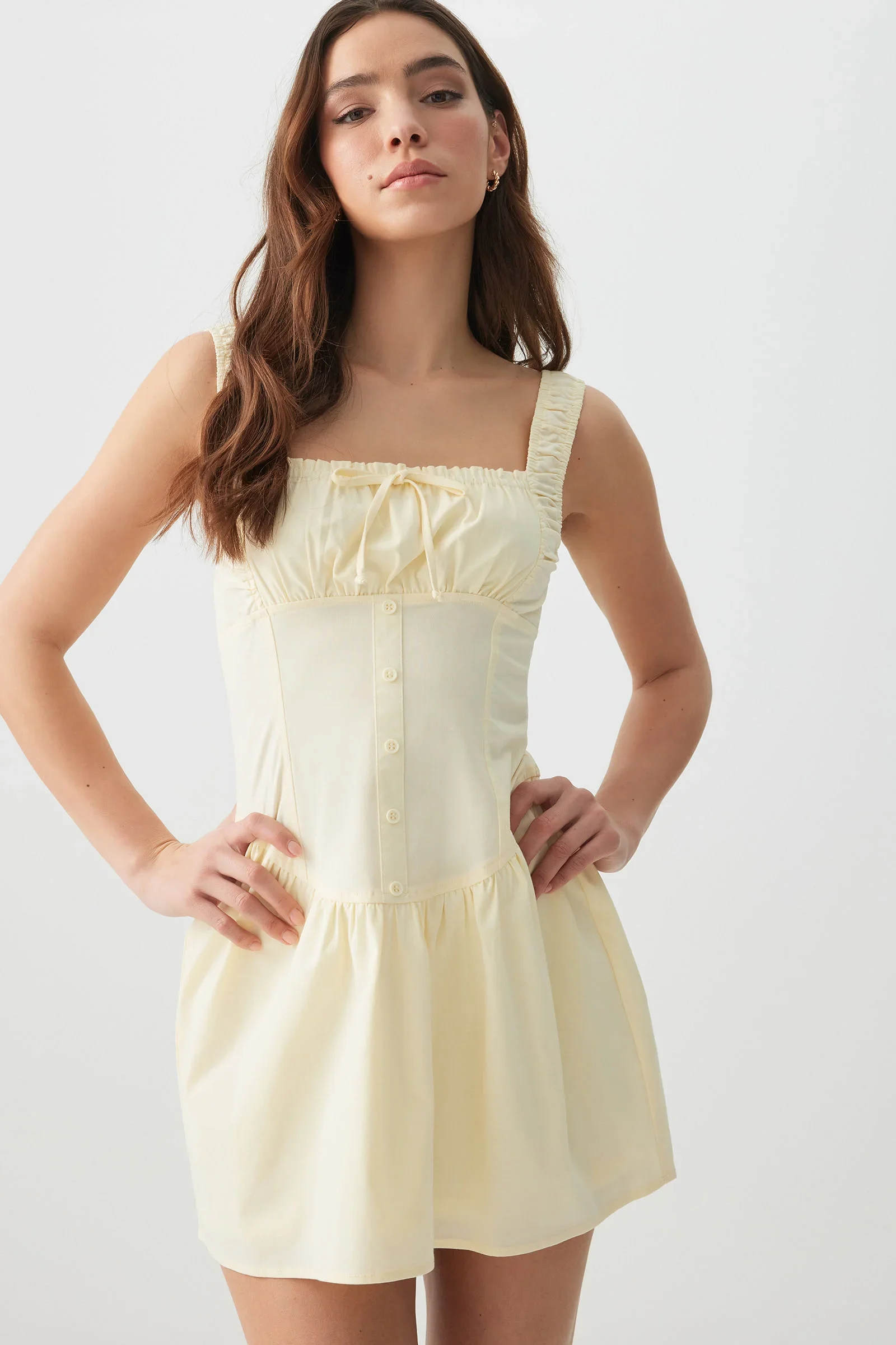 woman wearing yellow tank dress from Ardene